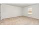 Bright bedroom with neutral carpeting, a window offering natural light, and a calming atmosphere at 385 Dasu Dr, Clayton, NC 27520