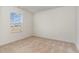 Bright, carpeted bedroom featuring a window overlooking outdoor space at 385 Dasu Dr, Clayton, NC 27520