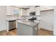 Modern kitchen with stainless steel appliances, granite countertops, and white cabinetry at 385 Dasu Dr, Clayton, NC 27520