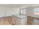 Bright kitchen featuring a gray island with granite countertops, stainless steel appliances and ample space at 385 Dasu Dr, Clayton, NC 27520