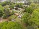 Aerial view showcasing the property's layout, landscaping, sheds, and neighborhood setting at 3913 Vesta Dr, Raleigh, NC 27603