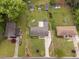 Aerial view of the property showing the house, surrounding landscaping, and multiple sheds at 3913 Vesta Dr, Raleigh, NC 27603