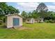 Spacious backyard featuring multiple sheds, offering ample outdoor storage solutions at 3913 Vesta Dr, Raleigh, NC 27603