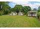 Expansive backyard featuring multiple storage sheds, perfect for organization and hobbies at 3913 Vesta Dr, Raleigh, NC 27603