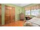 Cozy bedroom featuring a wooden closet, and natural light, creating a relaxing space at 3913 Vesta Dr, Raleigh, NC 27603