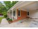 Charming brick home featuring a convenient carport with a covered entryway at 3913 Vesta Dr, Raleigh, NC 27603