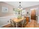 Dining room featuring charming wood table and chairs, a hanging light fixture, and decor at 3913 Vesta Dr, Raleigh, NC 27603