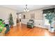 Cozy living room with wood flooring, decor, an accent chair and a Christmas tree near a doorway at 3913 Vesta Dr, Raleigh, NC 27603