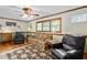 Comfortable living room with hardwood floors, plush seating, and a ceiling fan for a cozy atmosphere at 3913 Vesta Dr, Raleigh, NC 27603
