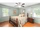 Serene main bedroom with a wooden bed frame, side tables, and soft lighting for relaxation at 3913 Vesta Dr, Raleigh, NC 27603
