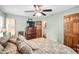 Main bedroom with warm lighting, comfortable bed, dresser, and multiple entrances for convenience at 3913 Vesta Dr, Raleigh, NC 27603