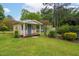 Storage shed features a charming porch area and practical double-door design at 3913 Vesta Dr, Raleigh, NC 27603