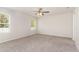 This bedroom includes carpeted floors, a ceiling fan, and two windows for lots of natural light at 3917 White Kestrel Dr, Raleigh, NC 27616