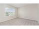 Empty bedroom with neutral carpet and natural light from the window at 3917 White Kestrel Dr, Raleigh, NC 27616