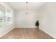 Dining room features wood flooring, recessed lighting, and a modern chandelier at 3917 White Kestrel Dr, Raleigh, NC 27616
