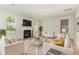 Bright living room boasts a fireplace, recessed lighting, and lots of natural light from the large windows at 3917 White Kestrel Dr, Raleigh, NC 27616