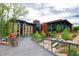 Modern community landscape with a playground, footbridge, and contemporary brick buildings surrounded by greenery at 408 Madison Ave, Cary, NC 27513
