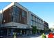 Contemporary brick building with modern architectural details, featuring retail space and ample window views at 408 Madison Ave, Cary, NC 27513