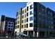 Modern apartment complex showcasing contemporary design with expansive windows and balconies at 408 Madison Ave, Cary, NC 27513