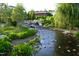 Scenic stream cascading over rocks, surrounded by lush greenery at 408 Madison Ave, Cary, NC 27513