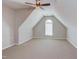 Spacious attic room featuring carpet, natural light, and vaulted ceiling at 413 Palafox Dr, Chapel Hill, NC 27516