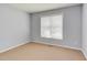 Neutral bedroom with carpet, light gray walls, and large window that provides natural light at 413 Palafox Dr, Chapel Hill, NC 27516