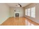 Bright living room with a fireplace, hardwood floors, and large windows at 413 Palafox Dr, Chapel Hill, NC 27516