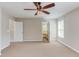 Spacious main bedroom with carpet, ceiling fan, neutral tones, and an en-suite bathroom at 413 Palafox Dr, Chapel Hill, NC 27516