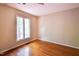 Bedroom featuring hardwood floors and a window providing natural light to the room at 416 Colony Woods Dr, Chapel Hill, NC 27517