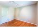 Cozy bedroom with hardwood flooring, neutral walls, and overhead track lighting at 416 Colony Woods Dr, Chapel Hill, NC 27517