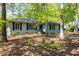 Inviting single-story home with beautiful trees and landscaping providing shade and privacy at 416 Colony Woods Dr, Chapel Hill, NC 27517