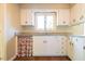 Clean kitchen featuring white cabinets, granite countertops, and tiled floors at 416 Colony Woods Dr, Chapel Hill, NC 27517