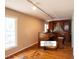 Spacious living room with hardwood flooring, neutral walls, and a non-functioning organ at 416 Colony Woods Dr, Chapel Hill, NC 27517