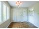 Mud room with tiled flooring, bright windows, and access to the exterior at 416 Colony Woods Dr, Chapel Hill, NC 27517