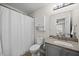 Well-lit bathroom has a shower and tub, updated vanity, and modern fixtures for comfortable living at 42 Riverwalk Ter, Durham, NC 27704