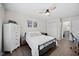 Cozy bedroom boasts natural light, clean white decor, and stylish furnishings for a serene retreat at 42 Riverwalk Ter, Durham, NC 27704