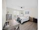 Bright bedroom with a ceiling fan, desk, dresser, and a large window for natural light at 42 Riverwalk Ter, Durham, NC 27704