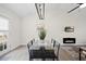 Bright dining room features modern light fixture, sleek glass table, and access to the outside at 42 Riverwalk Ter, Durham, NC 27704