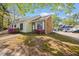 Charming home exterior with a brick facade, neutral siding and tidy landscaping at 42 Riverwalk Ter, Durham, NC 27704