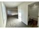 Hallway view to bathroom with granite vanity, tub and shower combo, and new fixtures at 427 Earnest Way # L24, Kenly, NC 27542