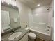 Well-lit bathroom with granite vanity and tub/shower combo at 427 Earnest Way # L24, Kenly, NC 27542