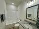 Well-lit bathroom with granite vanity and tub/shower combo at 427 Earnest Way # L24, Kenly, NC 27542
