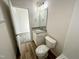 Bright bathroom featuring granite vanity, wood look floors, and a tub-shower combination at 427 Earnest Way # L24, Kenly, NC 27542