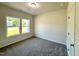 Cozy bedroom with two windows providing natural light and neutral carpeting at 427 Earnest Way # L24, Kenly, NC 27542