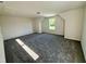 Bedroom featuring neutral walls and carpet, a bright window and dormered ceilings at 427 Earnest Way # L24, Kenly, NC 27542