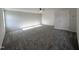 Spacious bedroom with neutral carpet, ceiling fan, and abundant natural light from a window at 427 Earnest Way # L24, Kenly, NC 27542