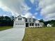 Charming two-story home featuring a two-car garage and beautifully landscaped front yard at 427 Earnest Way # L24, Kenly, NC 27542