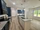 Modern kitchen with granite countertops, stainless steel appliances, and ample storage at 427 Earnest Way # L24, Kenly, NC 27542