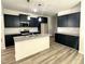 Contemporary kitchen featuring dark cabinets and a center island at 427 Earnest Way # L24, Kenly, NC 27542