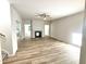 Spacious living room featuring hardwood floors and a cozy fireplace at 427 Earnest Way # L24, Kenly, NC 27542